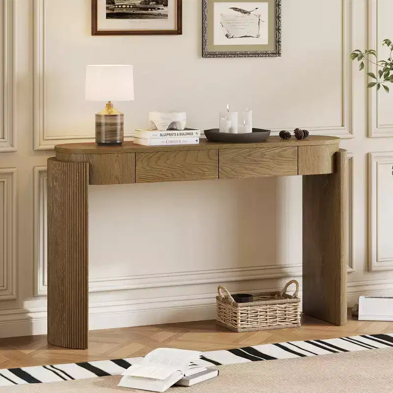 Mesa consola moderna con parte superior ovalada, patas curvas acanaladas y 2 cajones ocultos